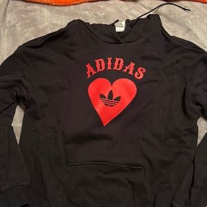 Adidas red heart with trig oil logo